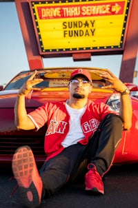 three men standing next to each other at night